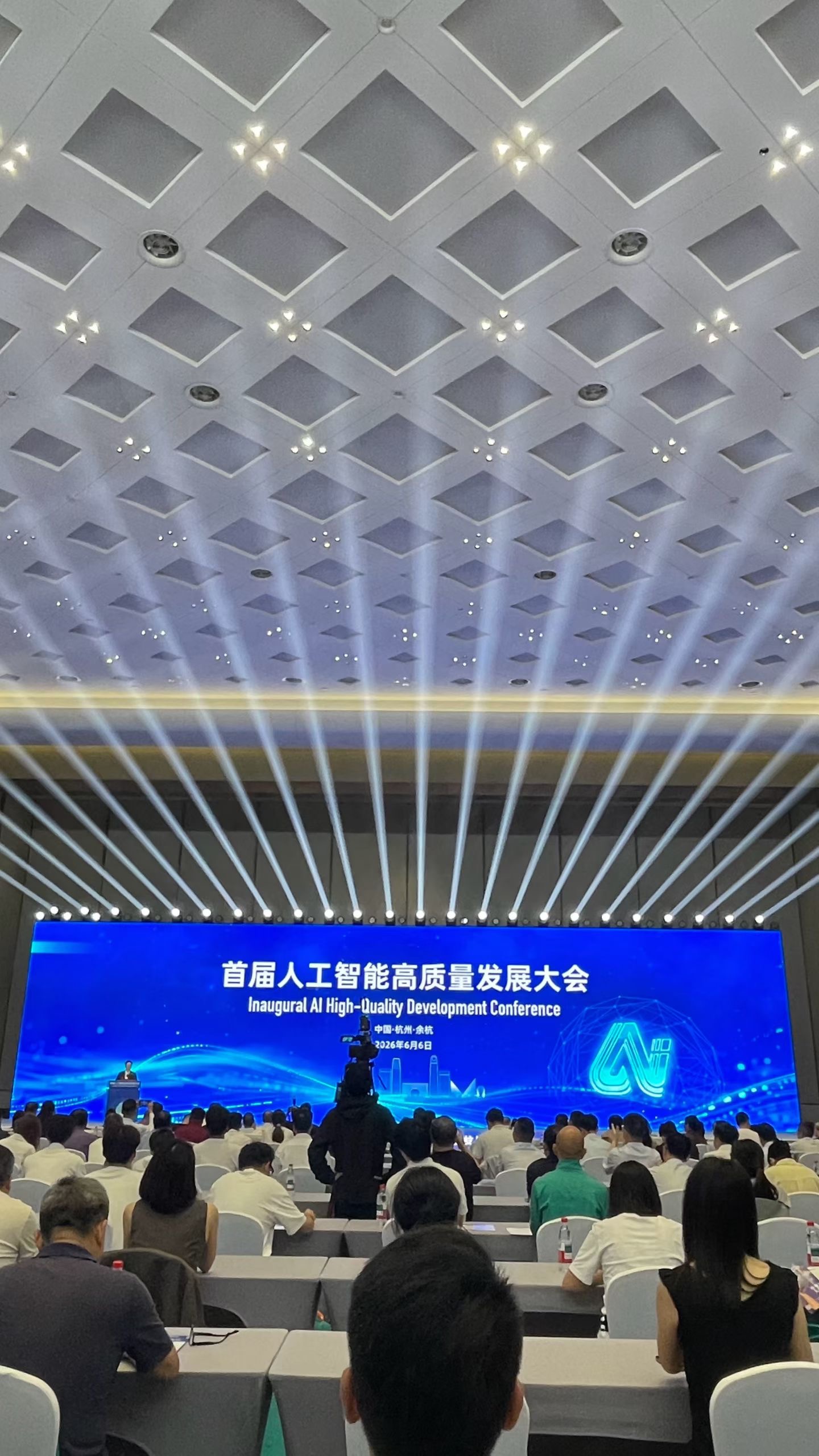 Speaker presenting on stage